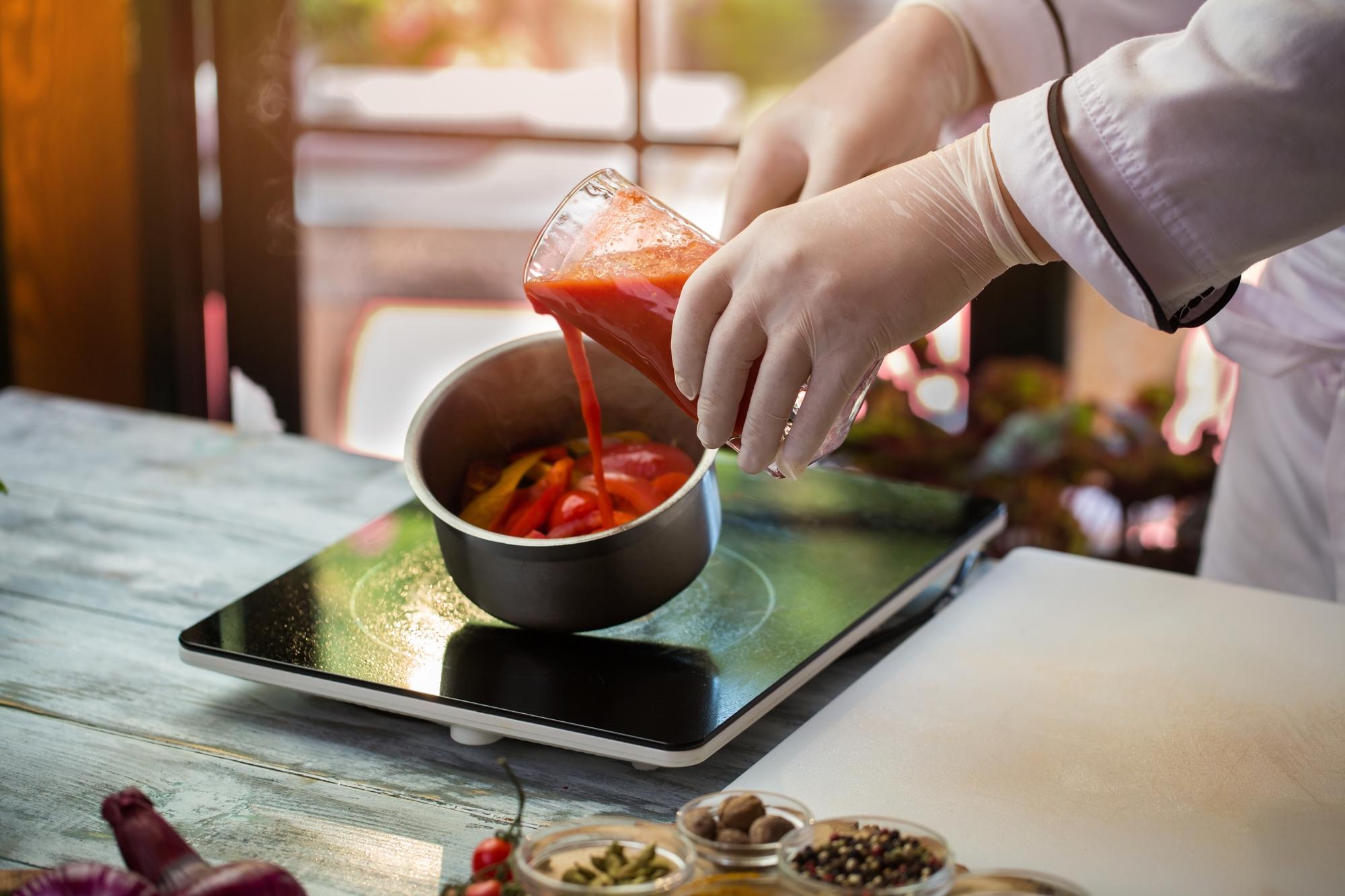 Instructor demonstrating a sauce technique